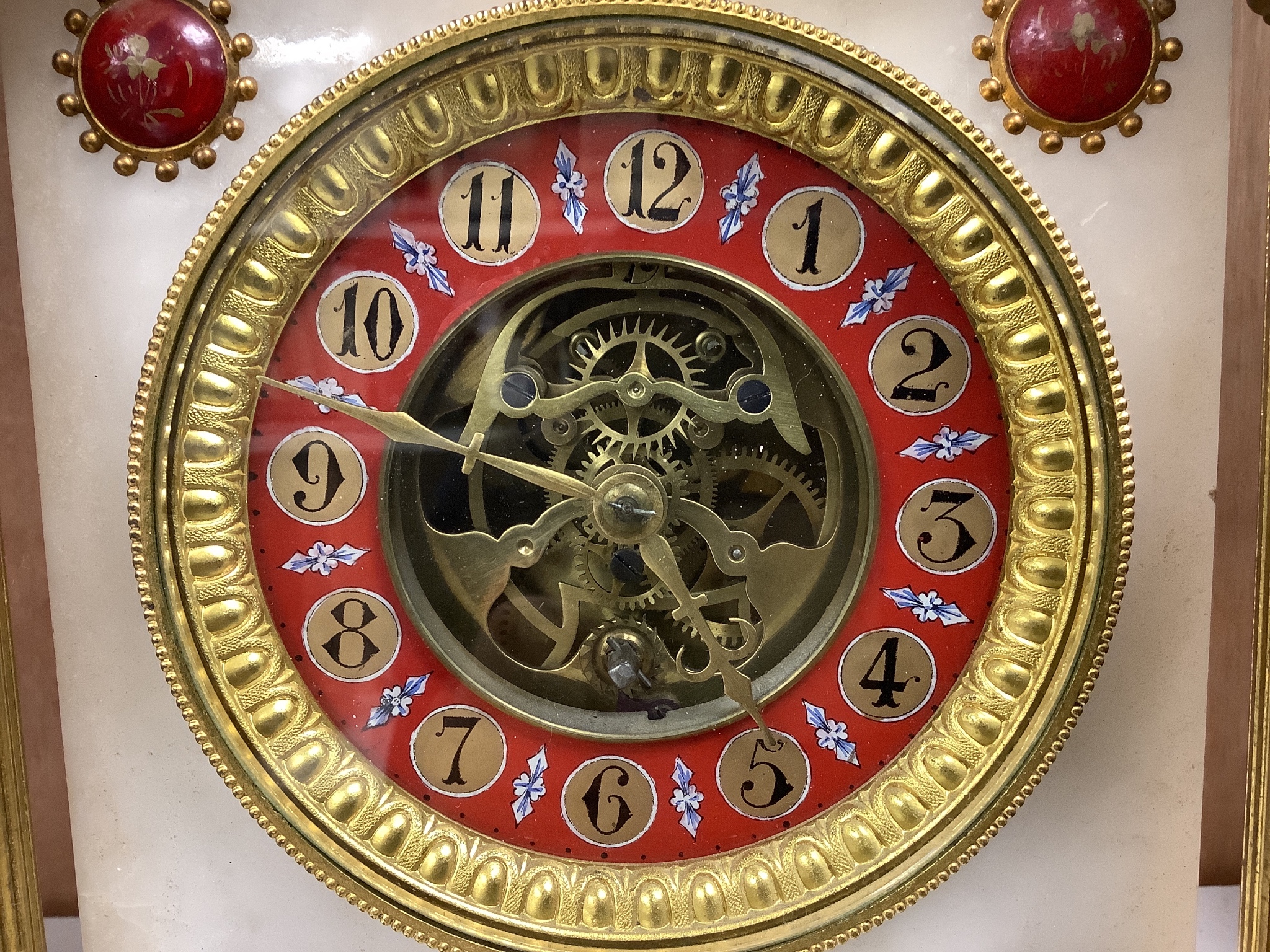 A Victorian alabaster mantel clock, with gilt metal lion surmount, French skeleton movement with pendulum, 34cm